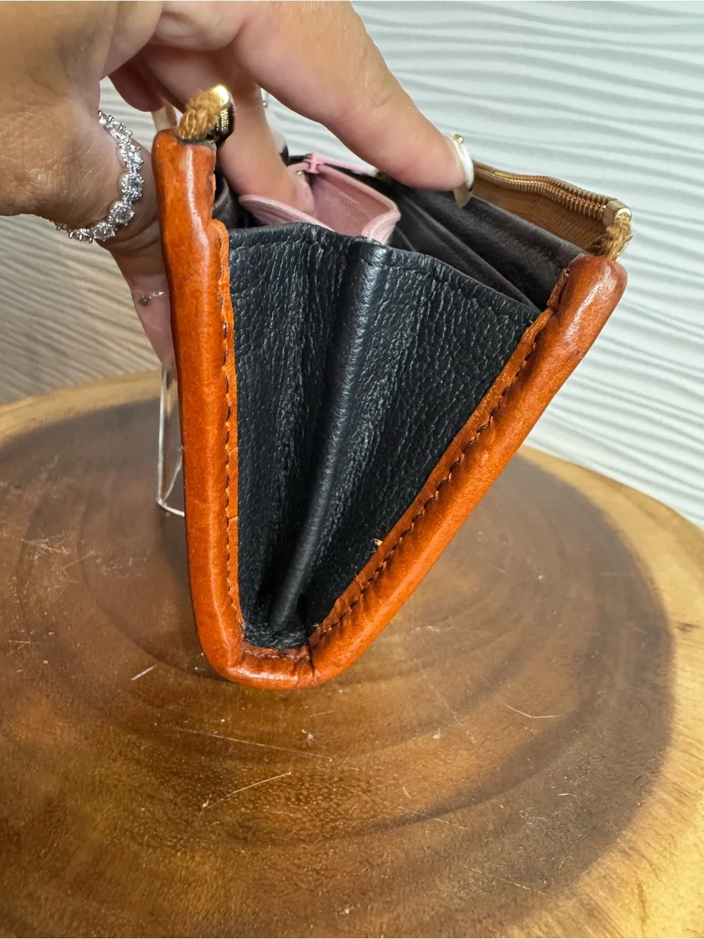 Dooney & Bourke Black Pebbled Leather Zip Wallet with Tan Trim and Logo Plate